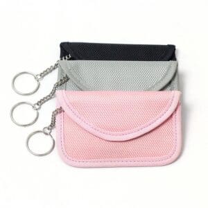 three rfid blocking bags with oxford fabric in black, grey and pink colors