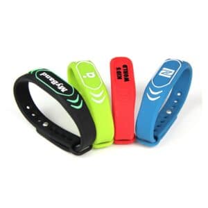 4 silicone rfid wristbands in black, green, red and blue with customer specific logo printed