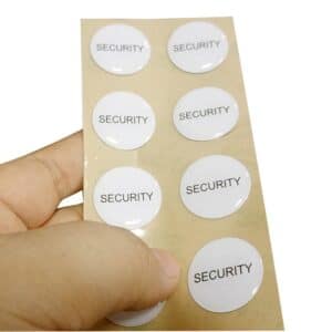 8 white security nfc labels holding in hand