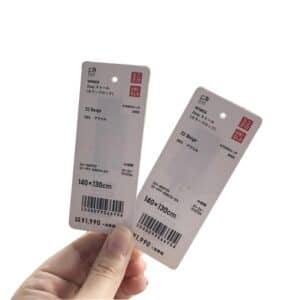 rfid paper hangtags from uniqlo showing rfid chip shining through