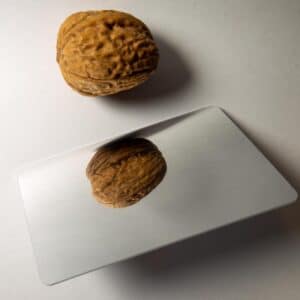 rfid smart card with mirror surface next to a nut